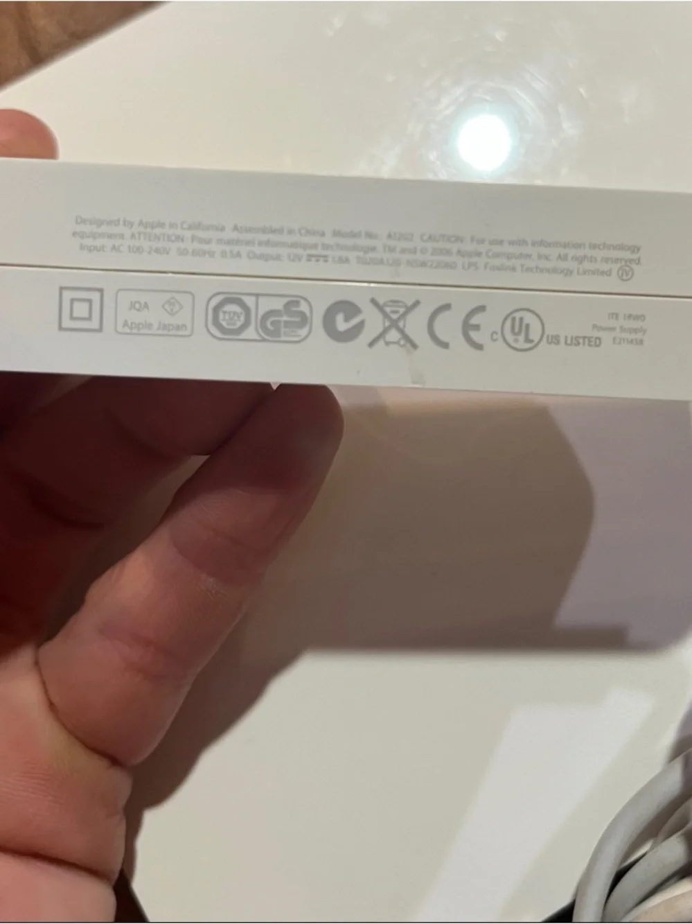 Apple AirPort Extreme base station with power supply.